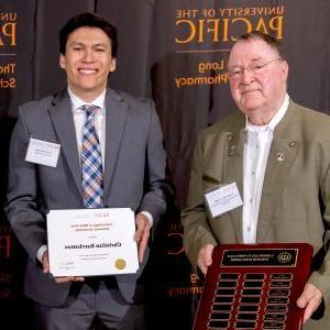 Pharmacy student Christian Barrientos with alumni donor Gerald D. Griffin